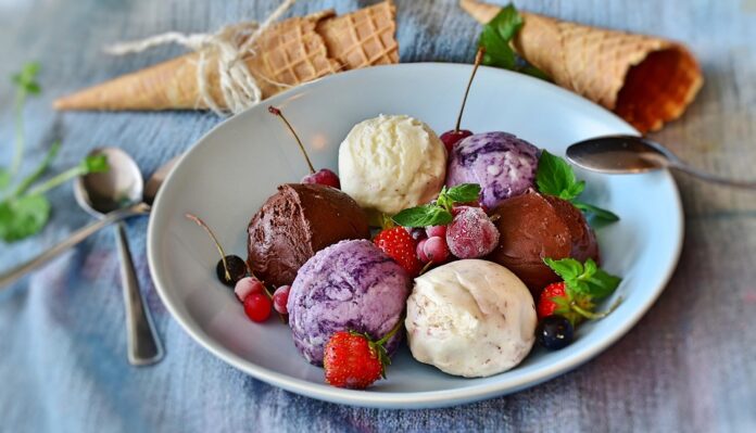 Chocolate enrobing and coating machines for ice cream novelties