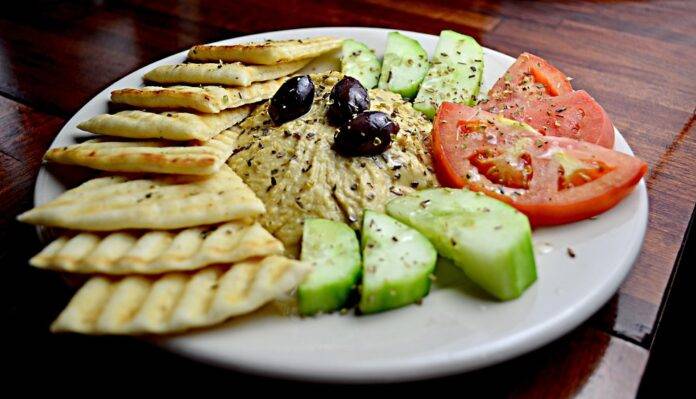 How Hummus Is Made From Chickpeas and Tahini to Finished Product