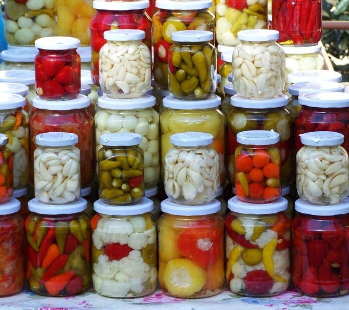 Lactic acid bacteria dosing systems for vegetable and grain fermentations