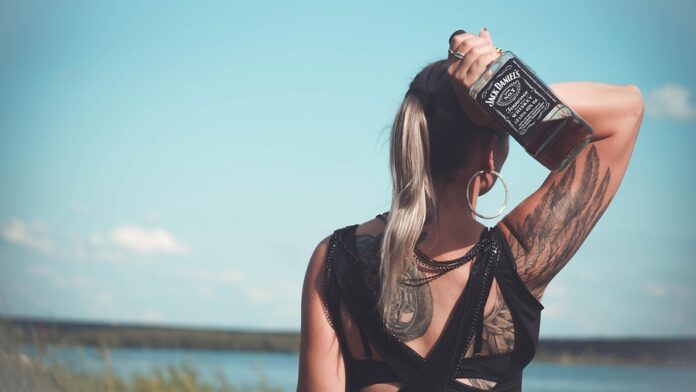 Why Tennessee whiskey is distinct from bourbon by charcoal mellowing